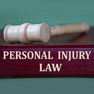 Gavel on a book titled 'Personal Injury Law,'